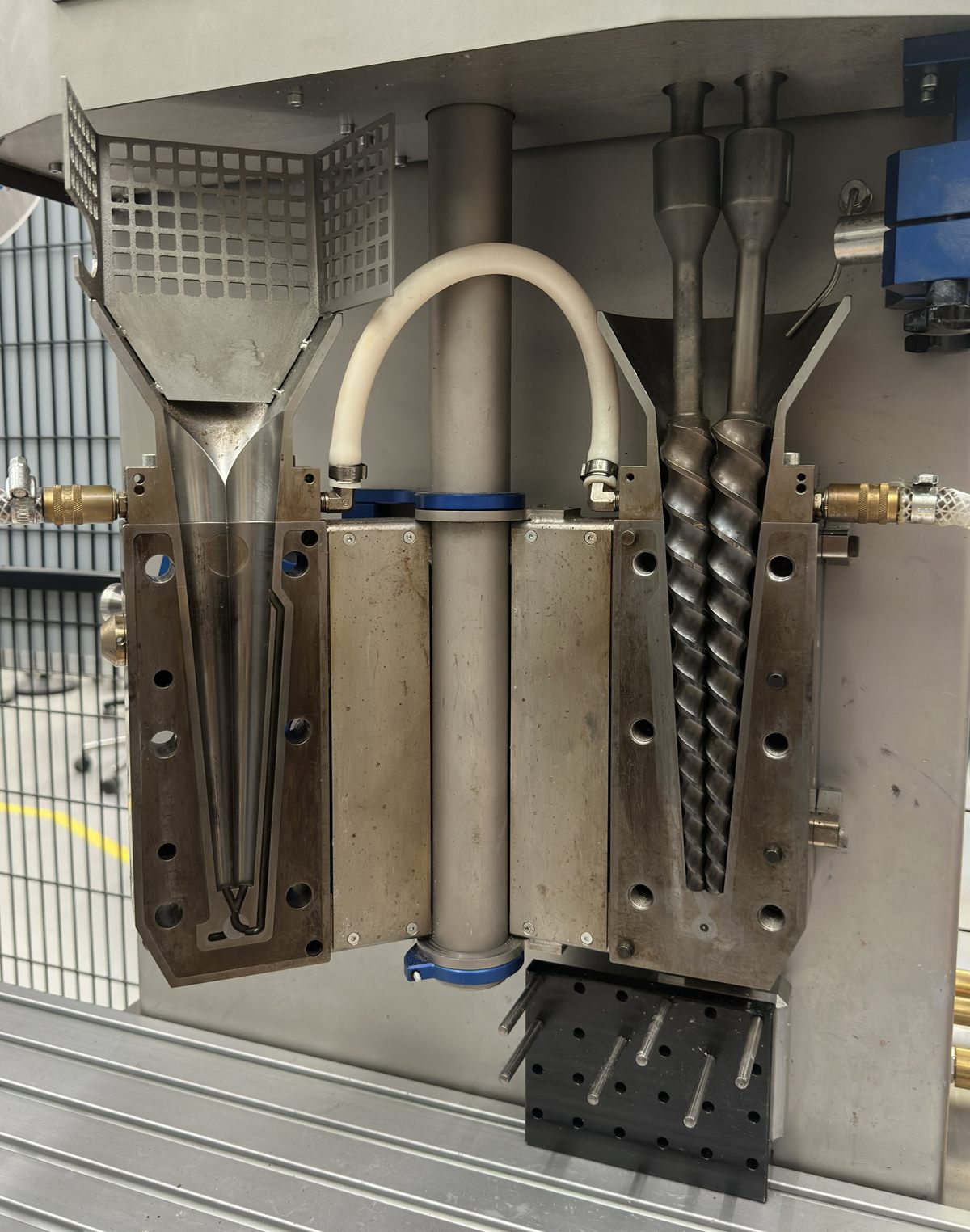 The micro-compounder at TU Delft, opened to show its twin screws